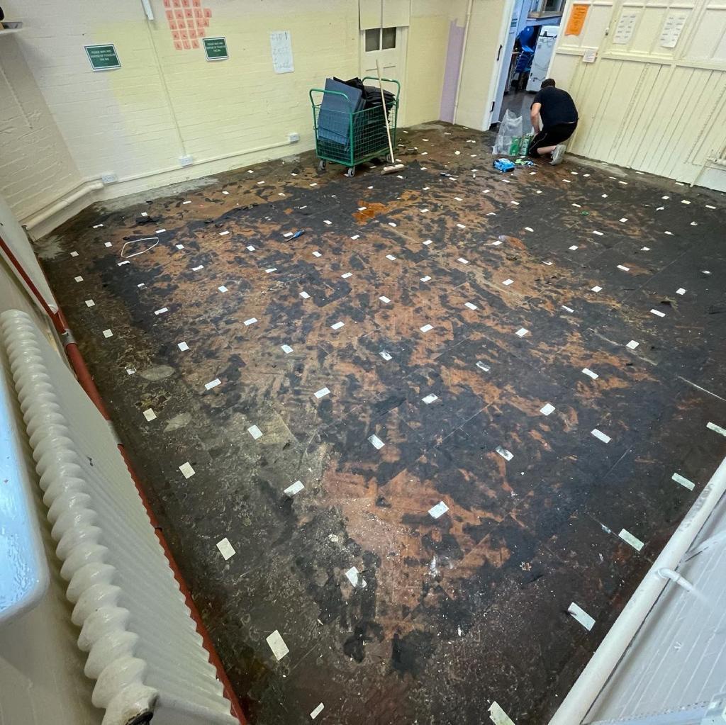 Pine parquet hall — old bitumen subfloor before restoration, by Fix Flooring London
