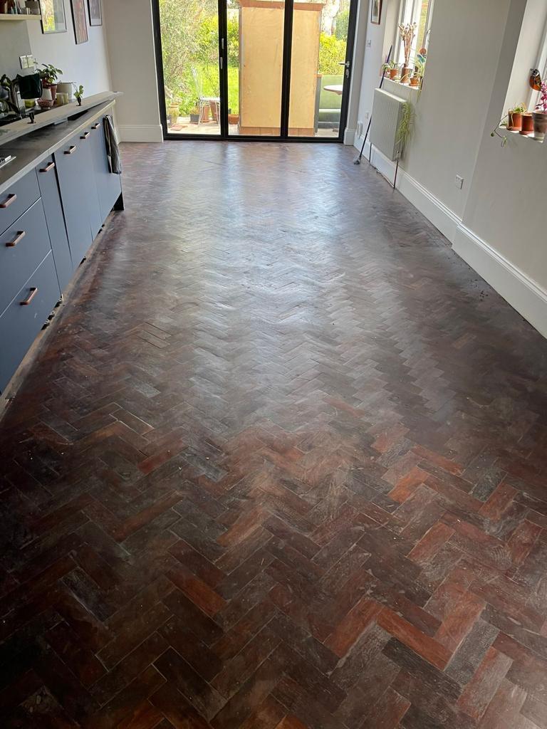 Kitchen herringbone parquet — tired and worn, before, by Fix Flooring London