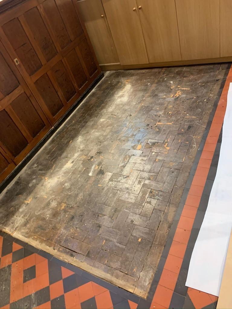 Reclaimed pine block floor — blackened and worn, before, by Fix Flooring London