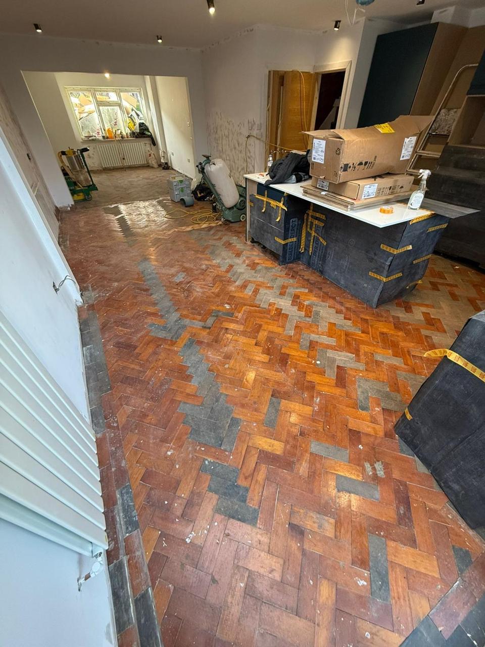 Reclaimed parquet — patched and repaired, before sanding, by Fix Flooring London