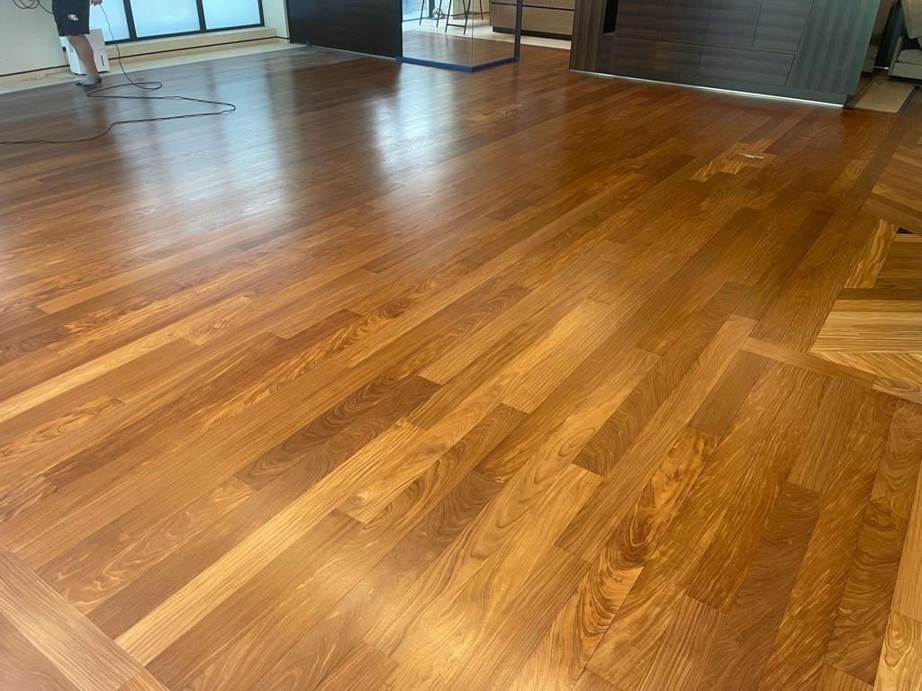 Commercial wood floor — restored to a glossy finish, by Fix Flooring London